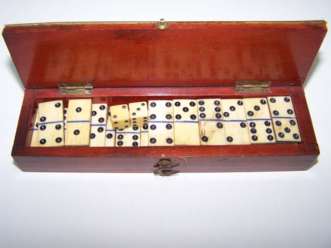 A 19th century miniature cased set of dominoes